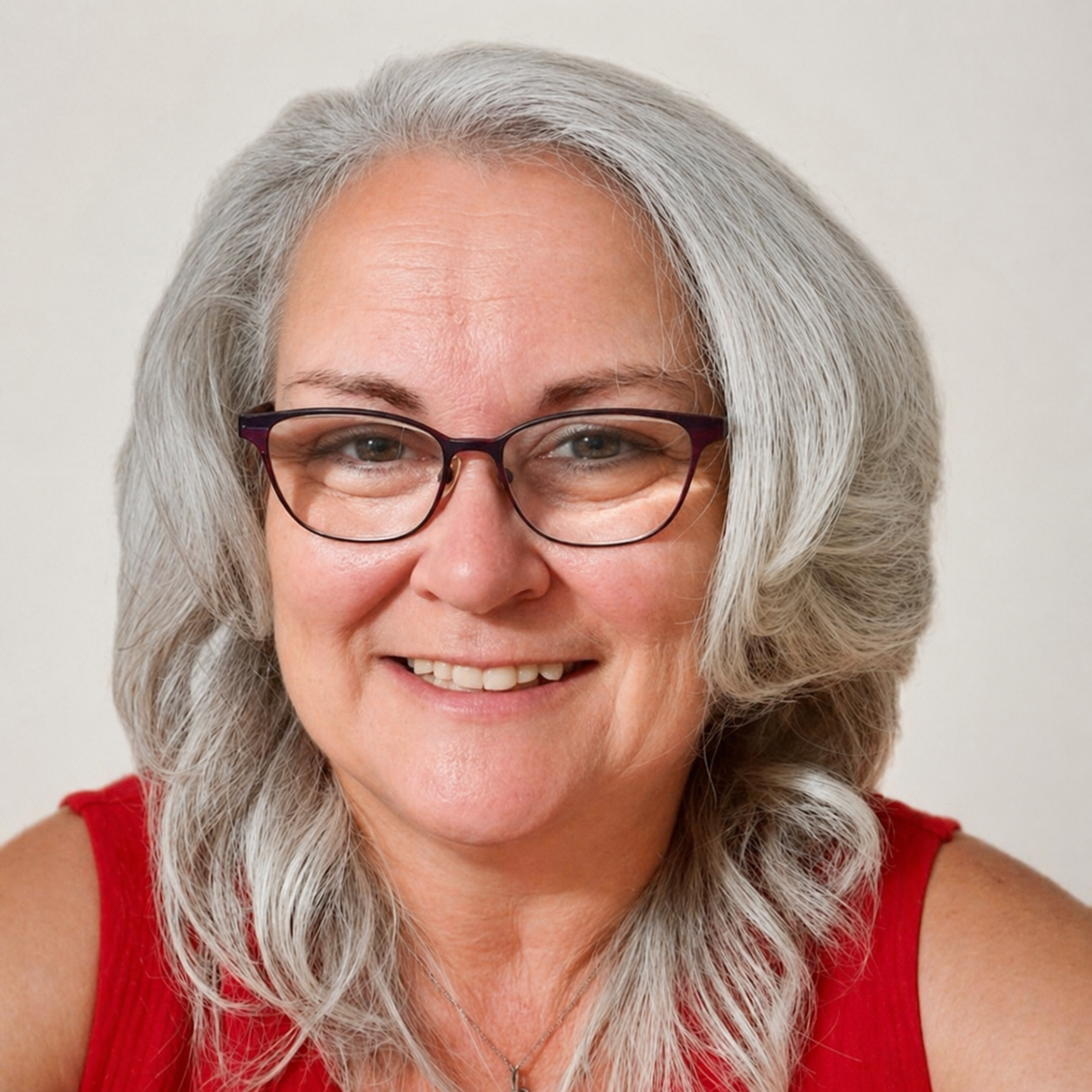 Portrait of Twila, The Rebel Nurse, smiling warmly.